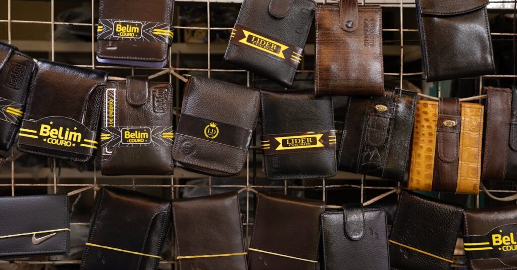 Collection of leather wallets on a market rack, showcasing diverse designs and finishes.