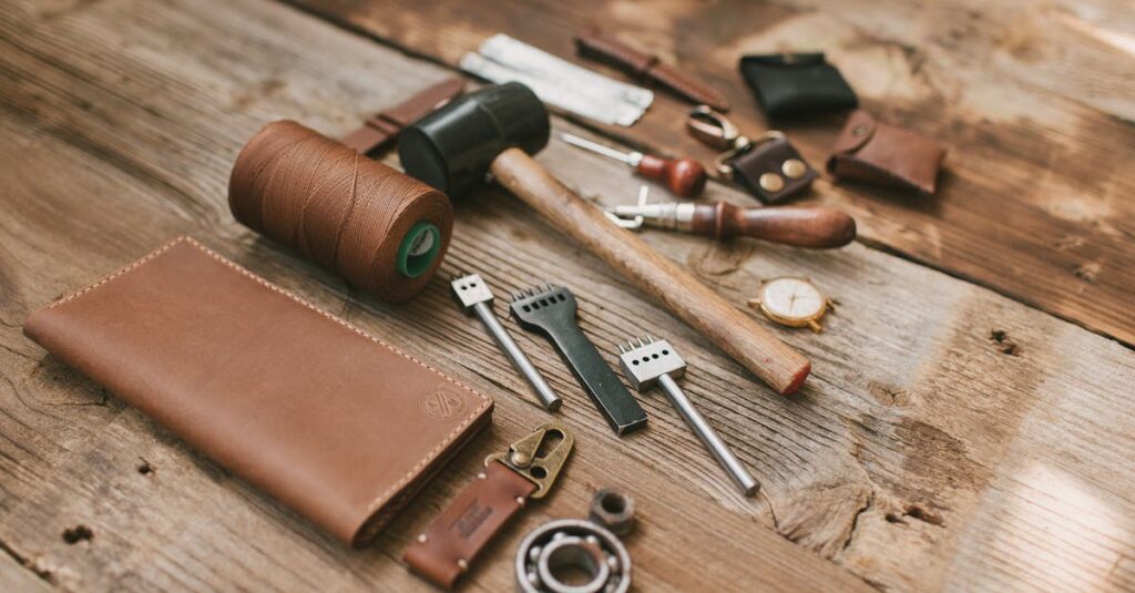 A collection of leather crafting tools neatly arranged on a wooden surface, emphasizing traditional craftsmanship.